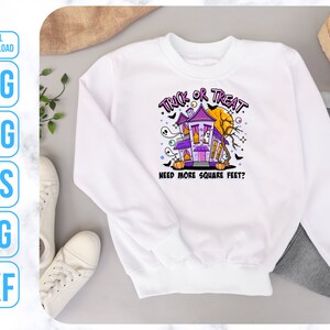 May include: White sweatshirt with a purple and black illustration of a haunted house with the text "Trick or Treat" and "Need more square feet?"