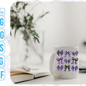 May include: White ceramic mug with a design of purple, black, and white bows. The mug is on a table with a book and a pen.