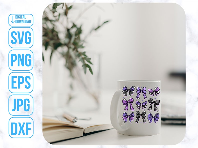 May include: White ceramic mug with a design of purple, black, and white bows. The mug is on a table with a book and a pen.