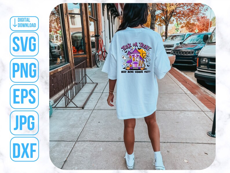 May include: A white t-shirt with a graphic of a purple haunted house with the text "Truck or Treat" and "Need more square feet?" printed on the back.