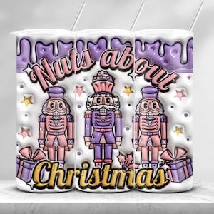 May include: A white tumbler with a purple and pink design featuring a nutcracker and the text "Nuts about Christmas".