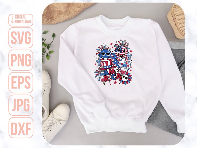 May include: White sweatshirt with a red, white, and blue graphic design featuring cartoon characters, fireworks, and the text "America".