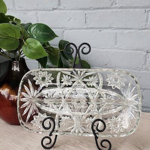 May include: A rustic wooden sign with the text "Welcome to our home" in white lettering. The sign features a distressed finish and a simple, inviting design, perfect for entryway decor.