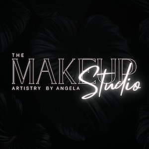 Puede incluir: El logotipo de The Makeup Studio artistry by Angela en texto blanco sobre un fondo negro con un diseño de hojas.