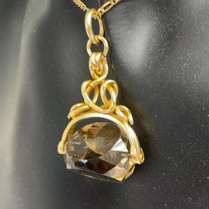 Antique gold cased swivel , spinner fob smokey quartz