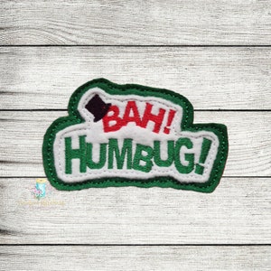 May include: Green felt patch with white stitching and the words "Bah! Humbug!" in red and green embroidery.