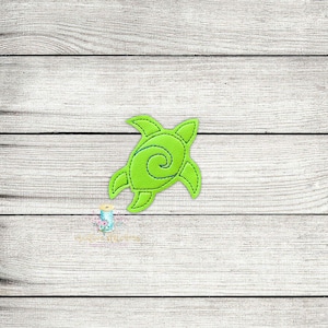 May include: A green felt applique of a stylised sea turtle with a swirl design on its shell.