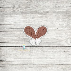 May include: An embroidered patch of two turkey legs, in brown and white.
