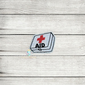 May include: A white first aid kit with a red cross and the word "AID" printed on it.