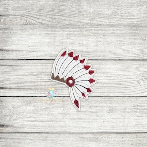 May include: White and red embroidered Native American headdress with brown trim.