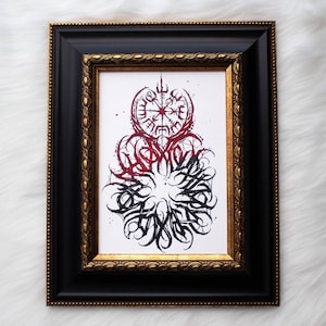 A black and red abstract painting featuring the vegvisir. In a black and gold frame with white faux fur in the background.