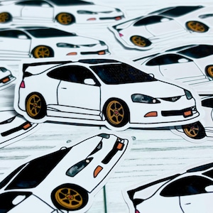 May include: White car stickers with black accents and gold wheels are scattered across a light-colored surface. The stickers feature a detailed illustration of a sports car, showcasing its design. The stickers are a great gift for car enthusiasts.
