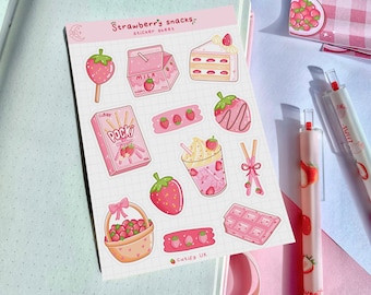 May include: A sticker sheet with a pink and white theme featuring strawberry snacks. The sheet includes a strawberry milk carton, strawberry cake, strawberry pocky, strawberry milk shake, strawberry chocolate bar, and a basket of strawberries. The sheet also includes a few small strawberry stickers.