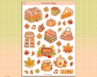 May include: A sheet of autumn-themed stickers with illustrations of sweaters, scarves, books, a pumpkin, a pie, a cup of coffee, a bowl of soup, a candle, a jar of honey, and leaves. The stickers are on a white background with a grid pattern. The text "Autumn days" is at the top of the sheet.