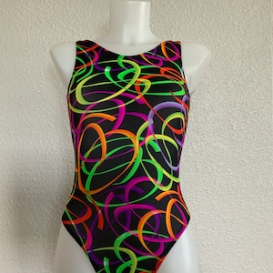 May include: Black leotard with a colorful abstract swirl pattern in green, orange, pink, and purple.