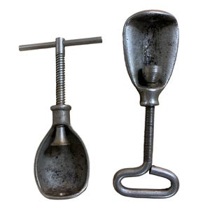 2 1940s-50s nut crackers with turn screw