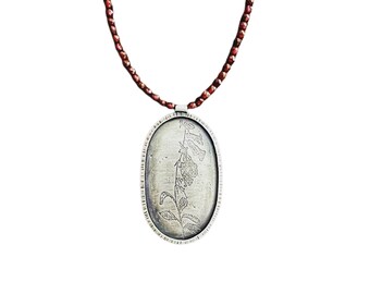 Etched sterling foxglove pendant on garnet necklace