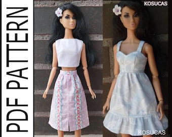 May include: Two fashion doll outfits. One doll wears a white crop top and a pink skirt with floral accents. The other doll is in a light blue dress with a leaf pattern and ruffled hem. The image includes the text "PDF PATTERN" and the brand name "KOSUCAS".