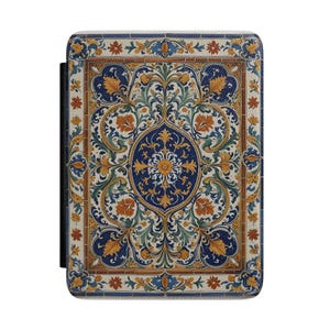 May include: A rectangular protective case for an electronic device featuring a detailed, symmetrical pattern of blue, orange, and green floral and leaf motifs on a cream background, enclosed within a decorative border of small tiles.