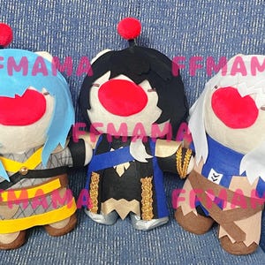 May include: Three plush dolls with large red mouths and red pom-poms on their heads. The dolls have different coloured hair and outfits, including blue, black, and white. The text "FFMAMA" is printed on the dolls.