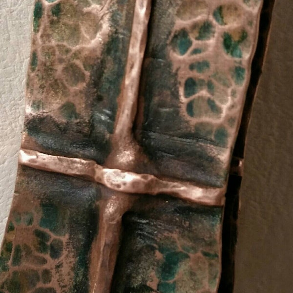 Crossed fold in copper patina