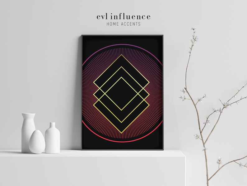 May include: A black and gold geometric print with a red and purple gradient circle in the background. The print is framed in a black frame and is titled "evil influence home accents".