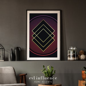 May include: A framed geometric print with a black background and a gold and red design. The design features a series of overlapping squares with a radiating pattern of lines in shades of red and gold. The print is titled "evil influence" and "HOME ACCENTS".