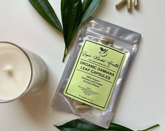 May include: A green and yellow pouch with a label that reads "Super Minded Health" and "Organic Damiana Leaf Capsules". The pouch contains 50 capsules, 510 mg each. The pouch is on a white surface with green leaves.
