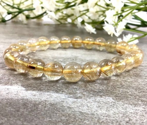 Gold Rutilated Clear Quartz Stretchy Bracelets Gold Rutilated Clear Quartz Stretchy Bracelets