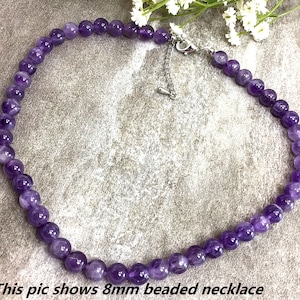 May include: A purple amethyst beaded necklace with a silver clasp. This pic shows 8mm beaded necklace.