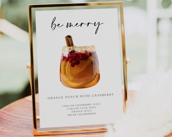 Może przedstawiać: Złoty znak z napisem "be merry" i grafiką szklanki z pomarańczowym ponczem z żurawiną, cynamonem i plastrami pomarańczy. Znak zawiera listę składników ponczu: schłodzony sok żurawinowy, schłodzona soda klubowa, sok pomarańczowy i świeże żurawiny.