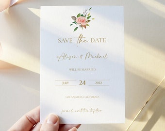 May include: Save the date card with a floral design featuring a pink rose and green leaves. The card reads "Save the Date" in gold lettering, followed by "Alison & Michael" in cursive script. The date is July 24, 2022, and the location is Los Angeles, California. The text "formal invitation to follow" is also included.