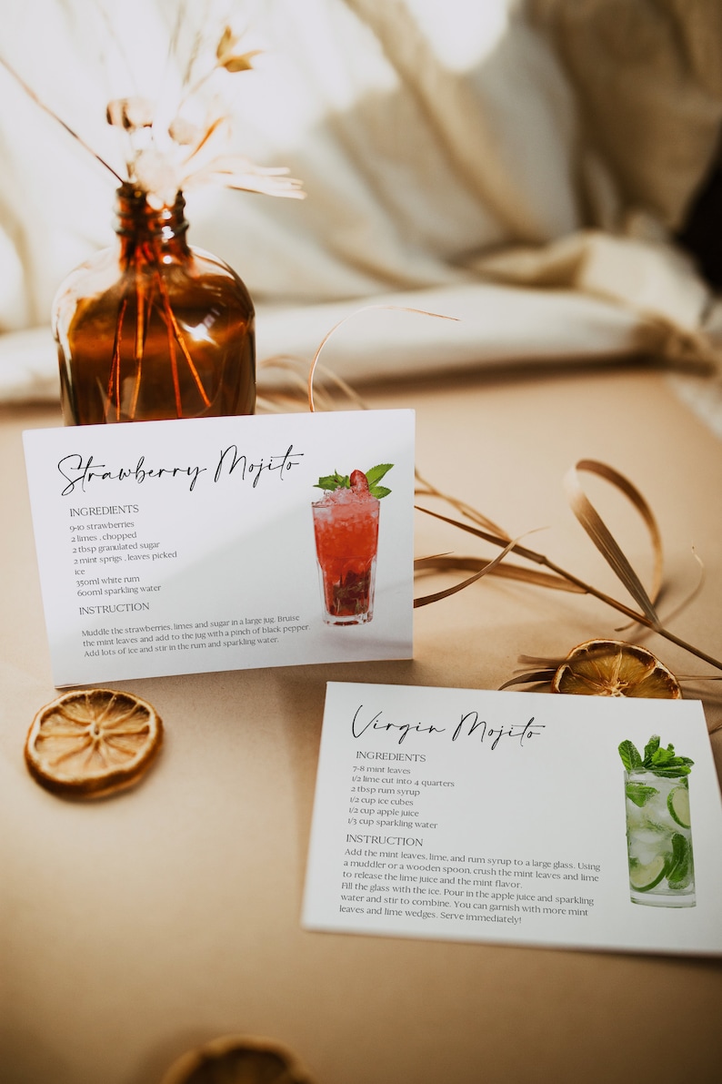 May include: Two recipe cards with instructions for making a Strawberry Mojito and a Virgin Mojito. The Strawberry Mojito card features a red cocktail with strawberries and mint. The Virgin Mojito card features a green cocktail with lime and mint.