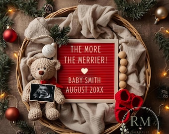 May include: A round wicker basket lined with beige fabric contains a red letter board with the text THE MORE THE MERRIER! BABY SMITH AUGUST 20XX, a tan crocheted teddy bear holding an ultrasound image, red baby booties, and wooden beads.