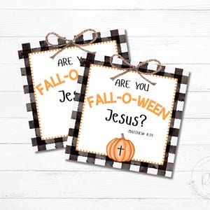 May include: Two printable signs with a black and white checked background. The signs read "Are you Fall-O-Ween Jesus?" with a pumpkin graphic and the scripture reference "Matthew 4:19".