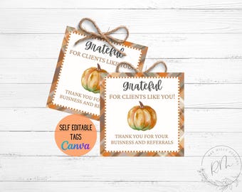 May include: Two square gift tags with a watercolor pumpkin illustration. The tags read "grateful for clients like you!" and "thank you for your business and referrals." The tags have a brown and orange chevron border and are tied with twine.