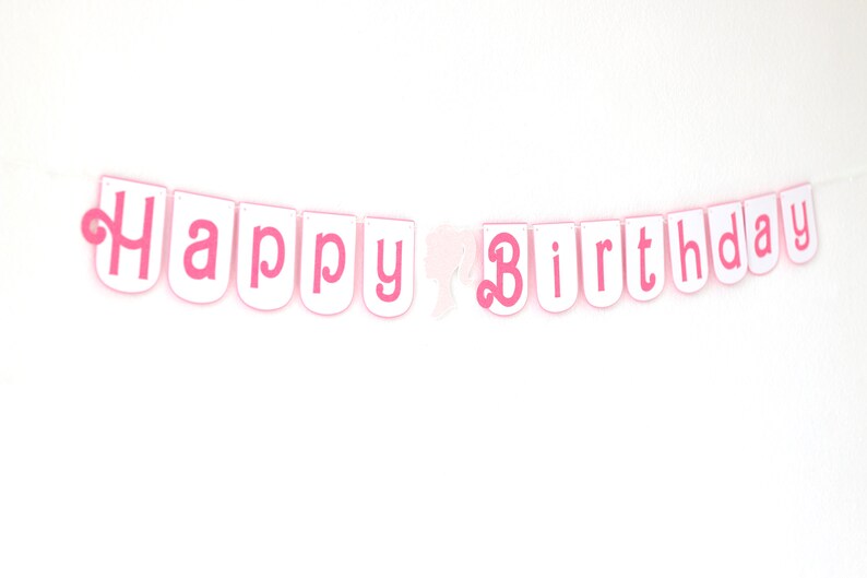 May include: Pink and white banner with the text "Happy Birthday" in pink letters.