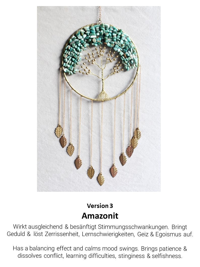 May include: A gold wire tree of life dreamcatcher with turquoise amazonite stones and gold leaf accents. The text "Version 3 Amazonit" is below the dreamcatcher.