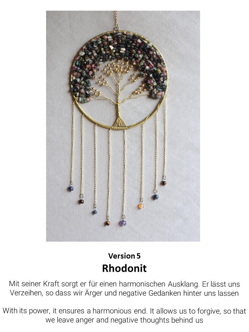 May include: A gold wire tree of life with pink, green, and black stones. The tree is hanging from a gold chain with smaller stones hanging from the branches. The text "Version 5 Rhodonit" is below the image.