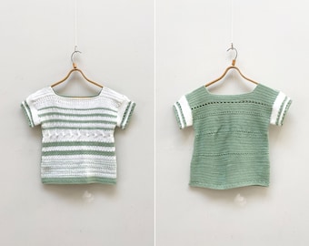 May include: Two crocheted tops, one with white and green stripes and the other solid green, both with short sleeves and a scoop neck.