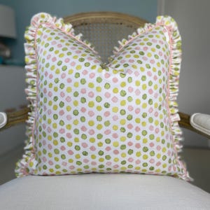 Schumacher Mini Bursts in pink and leaf colorway one sided 20 x 20 decorative pillow cover finished with contrast piping and self ruffle.