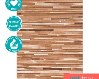 May include: A brown and beige striped rug made from ethically sourced leather. The rug is made with premium quality materials and is responsibly sourced.