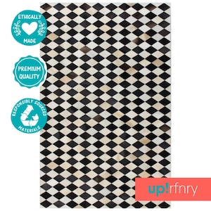 May include: Black and white diamond patterned cowhide rug. Ethically made, premium quality, and responsibly sourced materials.