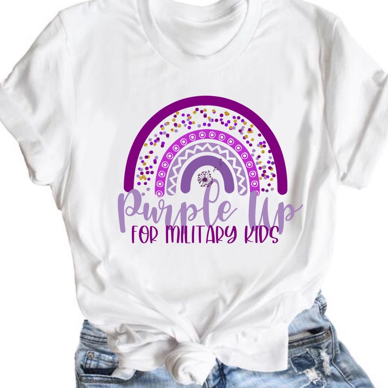 May include: White t-shirt with a purple rainbow design and the text "Purple Up for Military Kids".