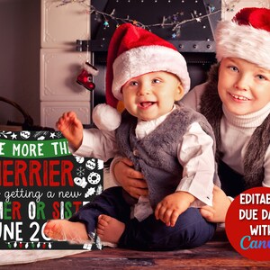 May include: A chalkboard sign with the text "The more the merrier, we're getting a new brother or sister, June 20". The sign is decorated with Christmas-themed graphics. Two children, one in a red Santa hat and the other in a white Santa hat, are sitting in front of the sign. A red circle with the text "Editable due date with Canva" is in the bottom right corner of the image.