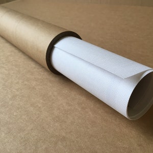 May include: A white canvas print rolled up and stored in a brown cardboard tube.