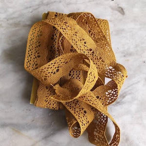 Antique old gold silk bobbin lace trim.