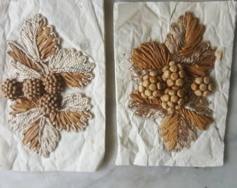 Two antique Edwardian raffia and silk hat applications.