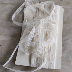 Antique Valenciennes lace inset trim.