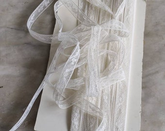 Antique Valenciennes lace inset trim.